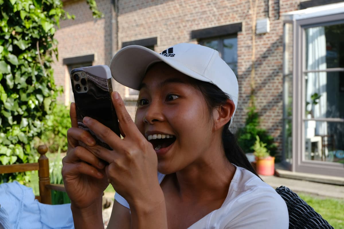 Creator checking earnings on phone