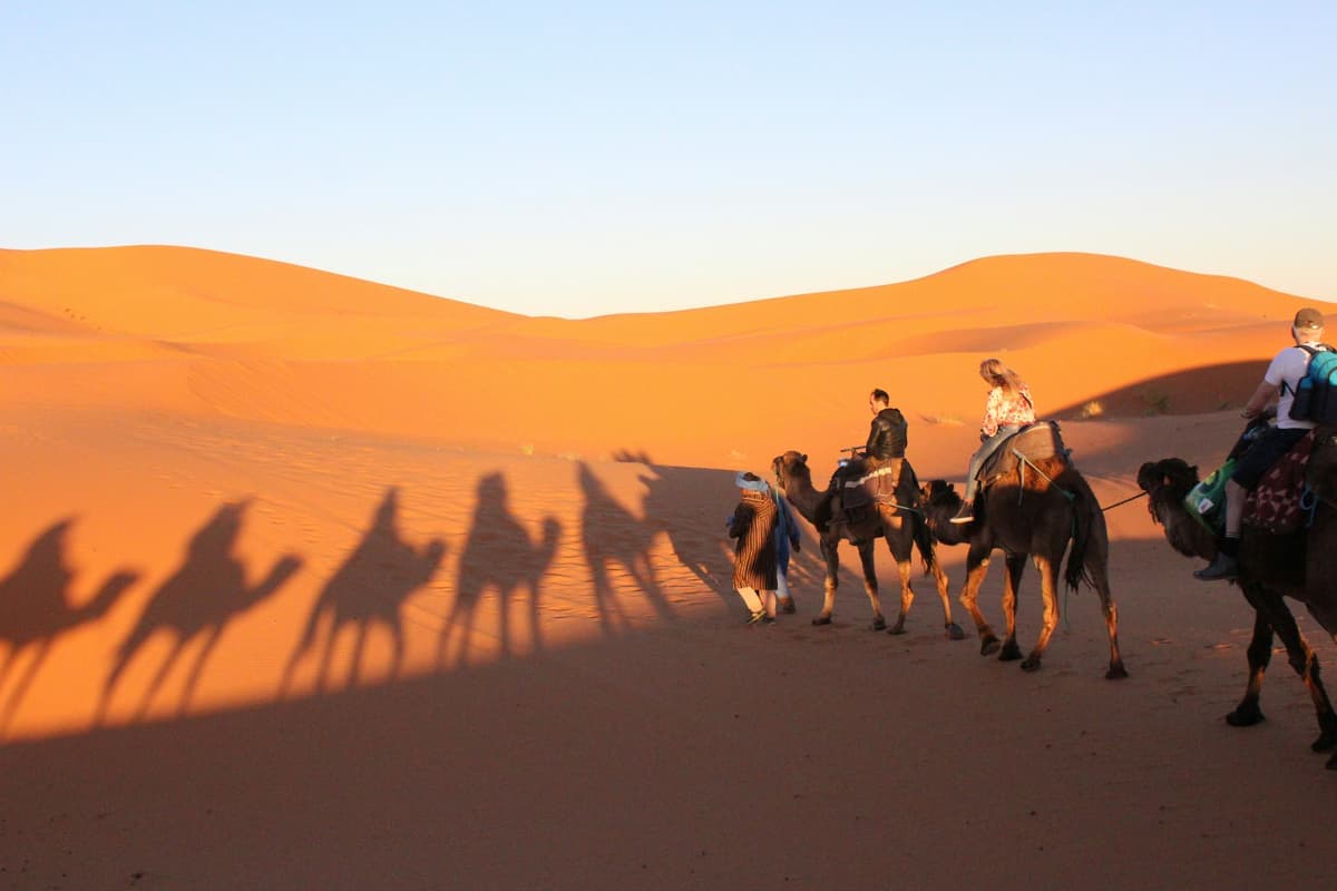 Travelers on a desert tour experience
